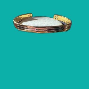 Electromagnetic 24K gold cuff bracelet.